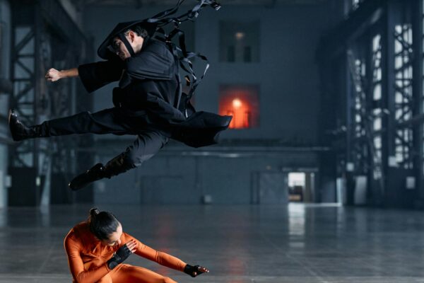 Stunning action shot of martial artists in cosplay, captured indoors with dramatic flair.